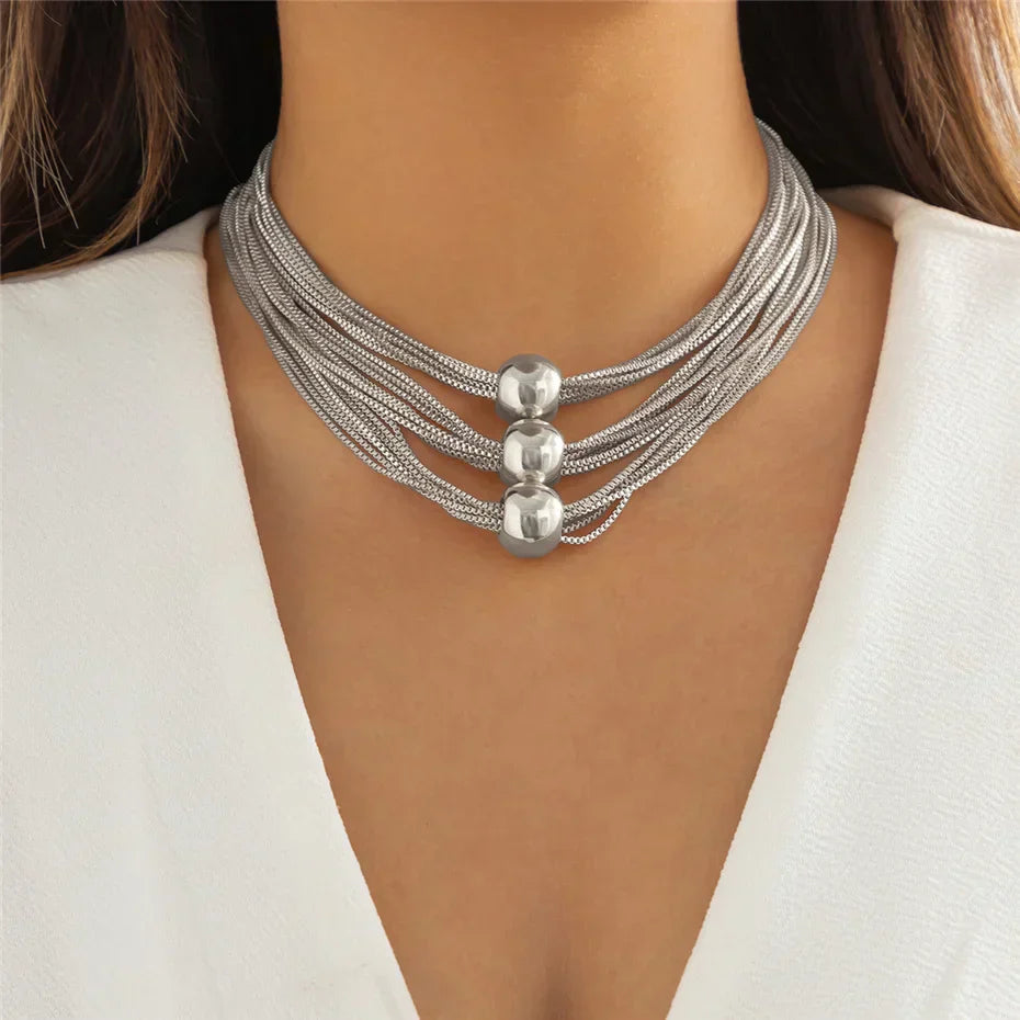 Nocturne draperat halsband med bollar